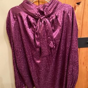 Beautiful purple leopard boutique blouse! Fun bow in the back of blouse.